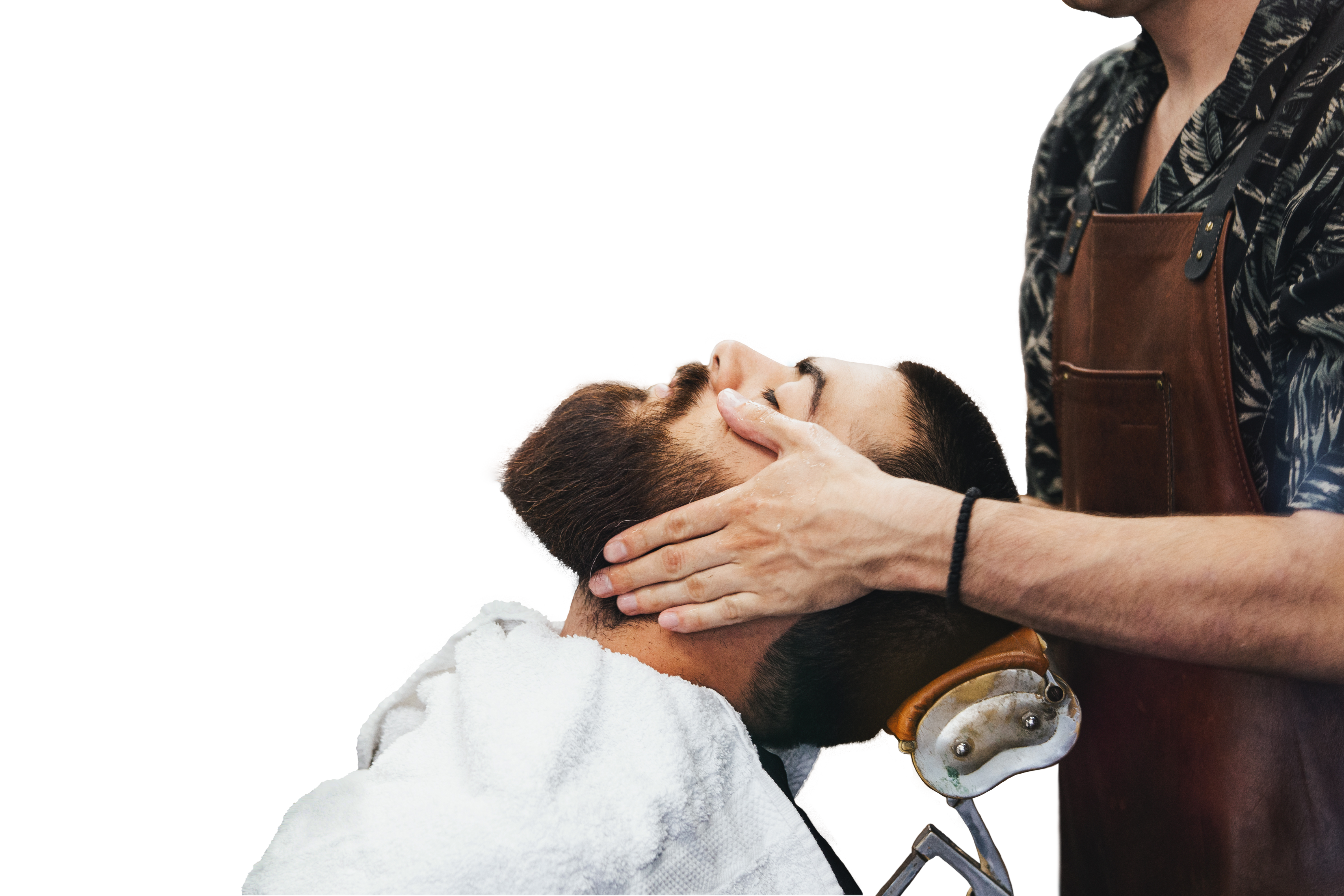 Professional barber applying THAW post-shave repair gel to client. 